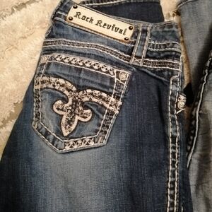 Rock Revival Women's Jeans with distressed look down front w Embellished pockets